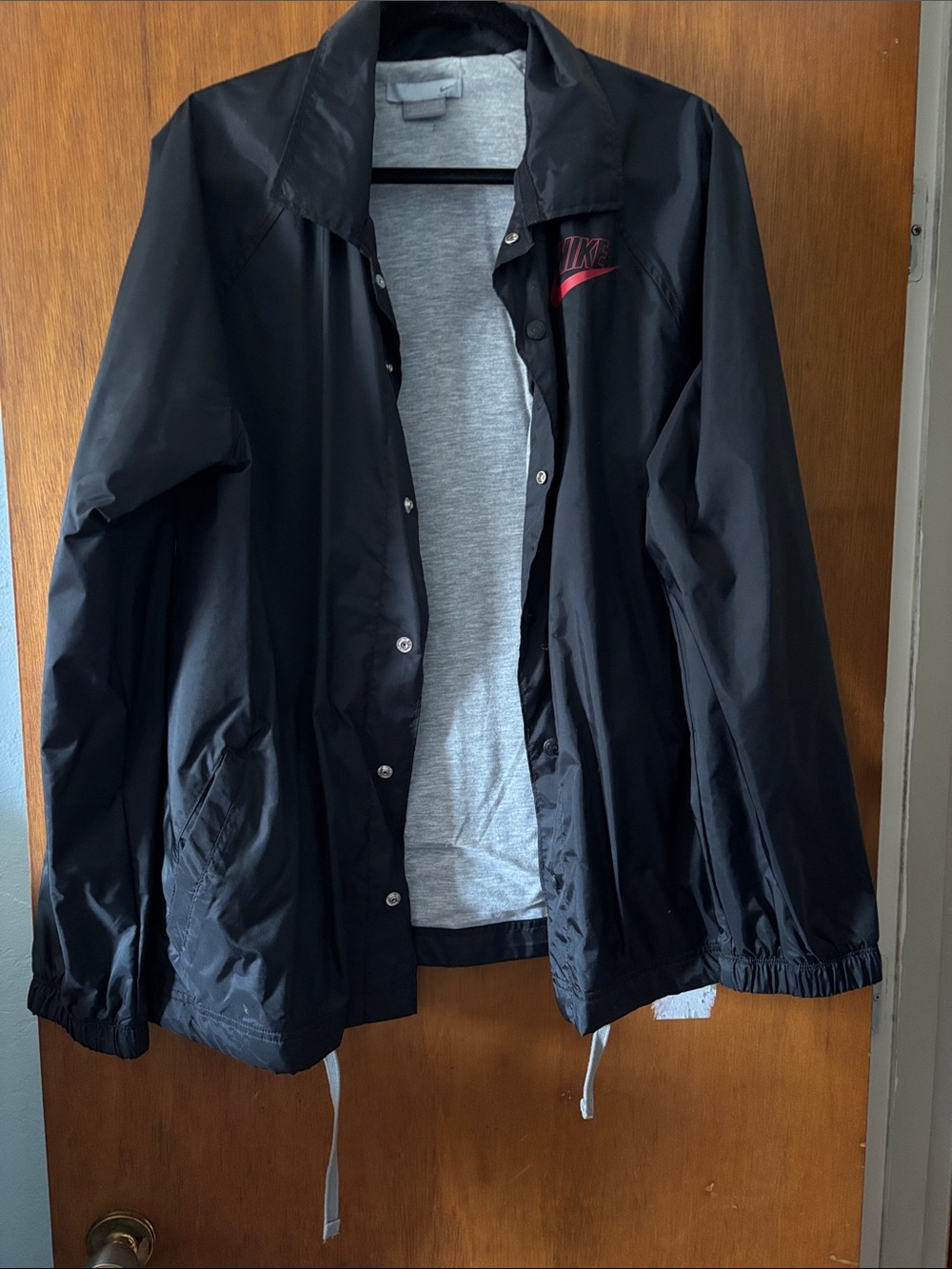 Nike Black Lightweight Coach Jacket with Red Logo